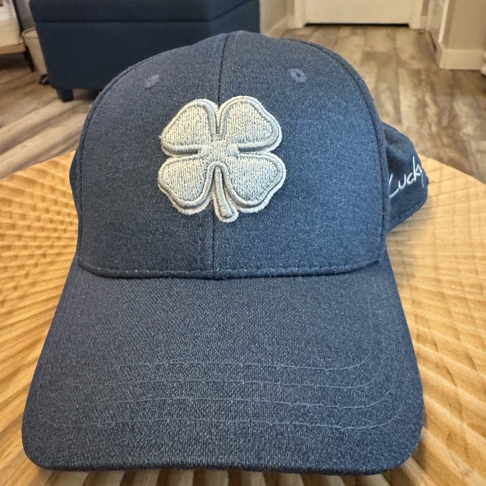 Black clover golf hat. NWOT!